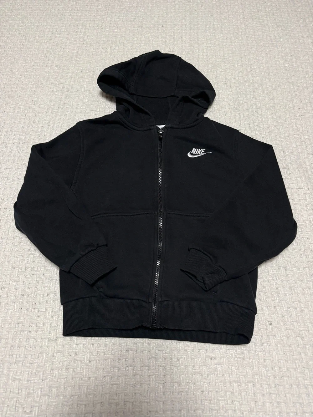 Nike black zip up youth hoodie size small.